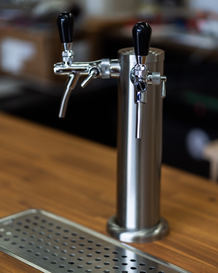 Close-up of the tap and timber counter